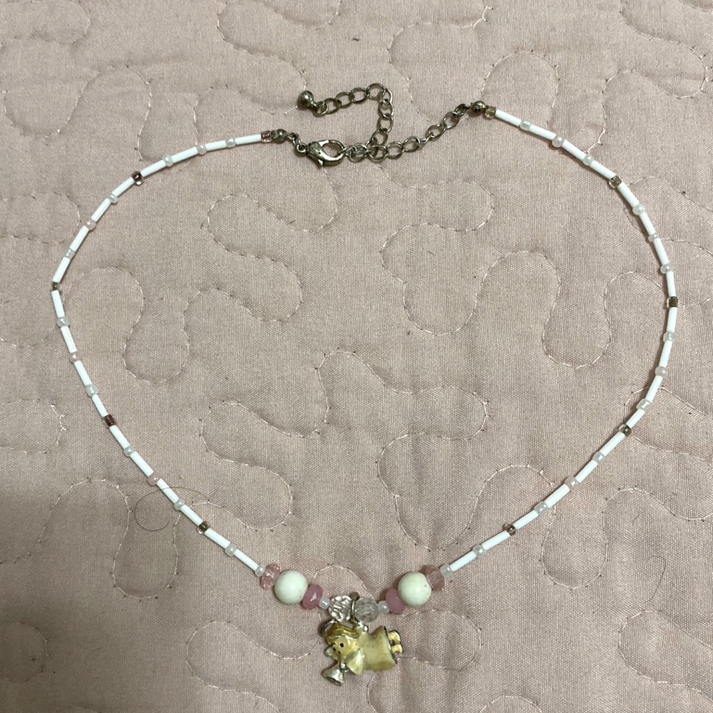Angel with a trumpet necklace, white and pink. Semi choker